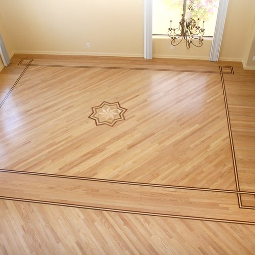 Star and border design floor planks at Artisan Wood Floor in Phoenix, AZ