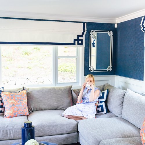 modern living room drinking tea on a sofa